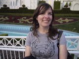 Smiling Woman at Elegant Garden Fountain Setting