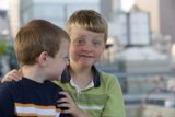 Two Boys Gazing at the Cityscape