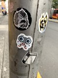 Sticker-Covered Pole on the Street