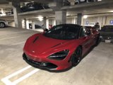 Red McLaren Coupe in Parking Garage
