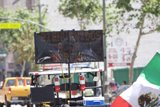 Mayday Protesters Gather Around Street Sign