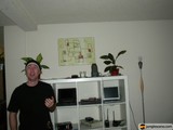 Decorative Plants Adorn White Bookcase in Living Room