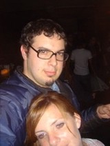 Couple Posing Together at a Nighttime Event