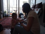 Mother and Child Enjoying Time Together with Remote Control
