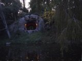 Illuminated Cave in the Forest