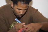 Dreadlocked Man with Toothbrush