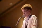 Microphone-Clad Performer Addresses Crowd