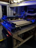 The Blue-Lit Manufacturing Machine