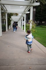 Child Walking Under White Pergola at Skywalker Ranch