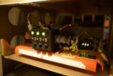 Small Electrical Device on Plywood Shelf