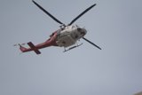 Helicopter Soaring in the Boundless Sky