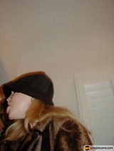Hat-wearing Woman at Bumrussians Dinner Party