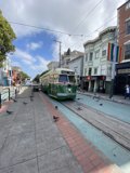 Green and White Trolley in the Heart of San Francisco