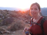 Desert Hiker Pauses at Golden Sunset Summit
