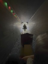 Underground Tunnel with Holiday Lights and Cart