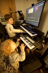 Young Brothers Creating Music in Home Recording Studio