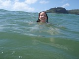 Smiling Woman Swimming in Hawaiian Ocean Waters