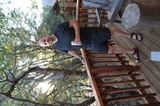 Man Relaxing on Wooded Deck with Drink