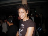 Curly-Haired Beauty in the Nightclub Crowd
