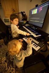 Young Brothers Creating Music in Home Recording Studio