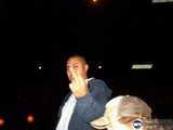 A Man's Commanding Gesture in the Night Sky