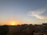 Adobe building glowing in sunset hues