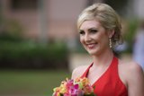 The Lady in Red with a Bouquet of Blooms