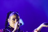 FKA twigs Incredible Close-Up Portrait Face Visible Arm Extended Dramatically Baby Hairs Elaborate Swirls Cat-Eye Makeup Hoop Earrings Black Choker Braided Ponytails Kimono Purple Blue Lighting Dynamic
