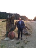 The Man and the Giant Hand Sculpture