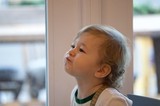 Young Child Looking Up with Wonder and Curiosity