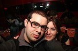Couple Poses Together at Dimly Lit Nightclub