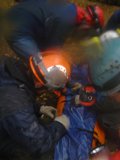 Rescue Workers in Protective Gear Work on Accident Victim