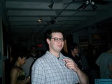The Glasses-wearing Art Enthusiast in the Urban Night Scene