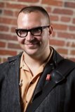 Happy Man in Jacket and Glasses