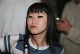 Black-Haired Woman with Accessories