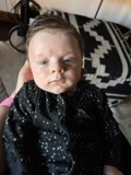 Blue-Eyed Baby in Chair