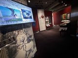 Art Enthusiasts Admiring the Painting Display at Walt Disney Museum