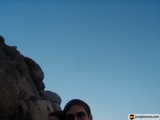 Standing Tall Against the Majestic Rock Formation