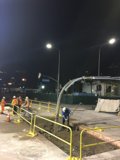 Construction Workers Building the Streets of LA at Night