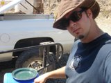 Man in Sunglasses and Hat with Pickup Truck