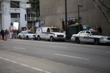 Parked Police Car on the Busy Street
