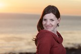 Woman in Red at Golden Sunset by the Sea