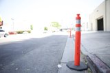 Red and White Traffic Cone on the City Street