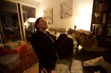 Woman and Cat Share a Cozy Christmas Eve Moment