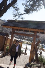 Visitor at Traditional Japanese-Style Garden Gate