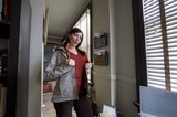 Woman in Doorway Arriving Home During Hanukkah