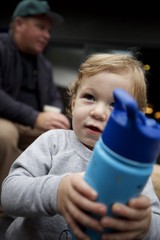 Young Child with Sippy Cup on Family Outing