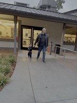 Father and Child Walking at Modern Museum