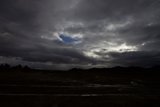 Dramatic Skies over the Rolling Hills