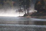 Helicopter Assists Fire Truck Near Lake